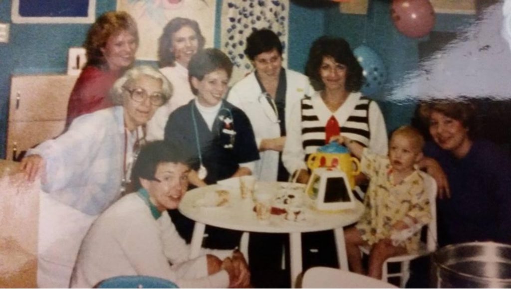 Ashley surrounded by Children's Minnesota staff on her last day of chemotherapy in 1986.