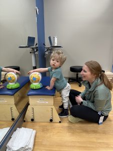 Clifford working with the physical therapy and occupational therapy team.