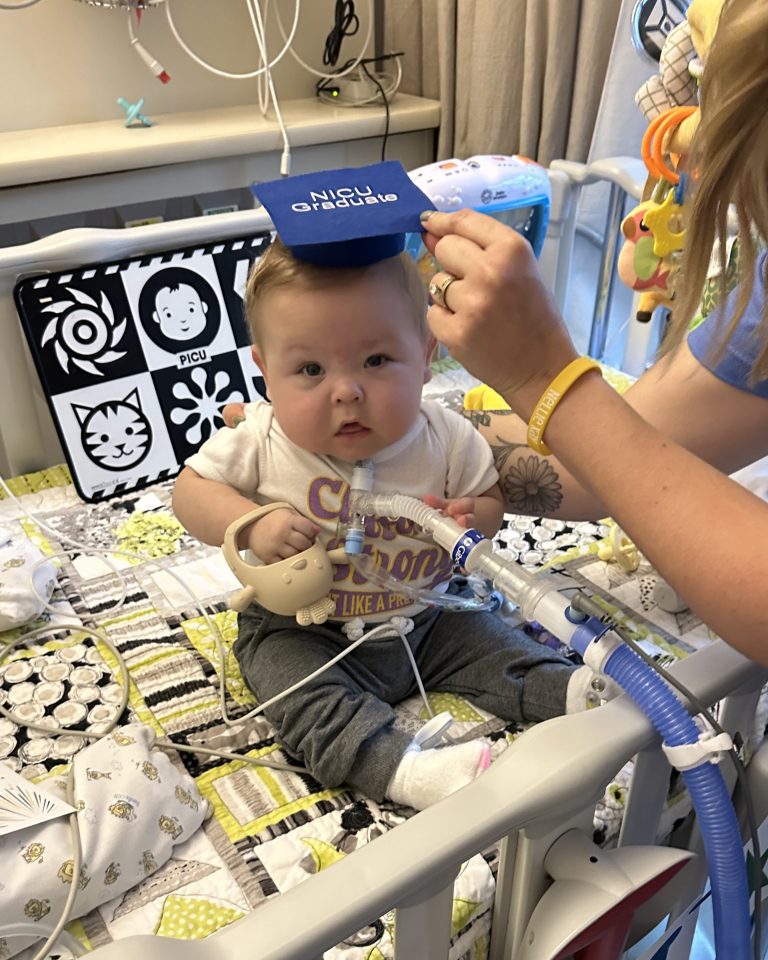 Clifford wearing NICU graduate hat