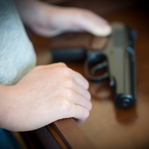 Teen finding a gun in a drawer at home.