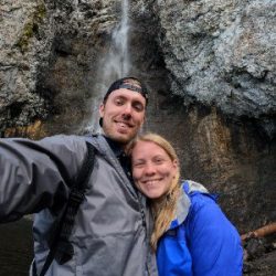 Sarah and her husband by a waterfall